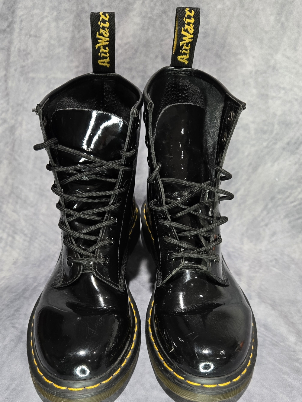 Dr. Martens Black Patent Combat Boots with Yellow Stitching